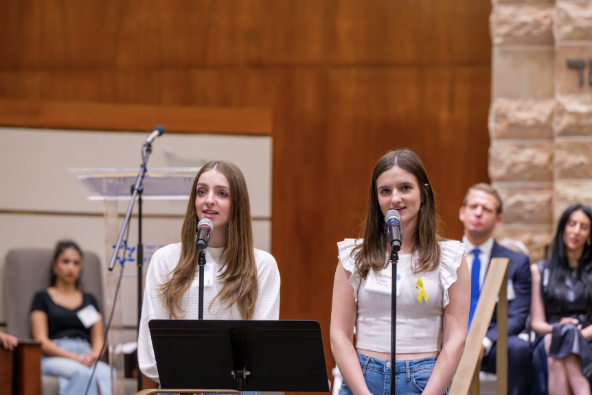 Carly and Annie Katz sing at Beth Yeshuran during the Remembrance, Unity, Hope: Marking One Year Since October 7 service. Photo by Hagit Bibi Photography. 